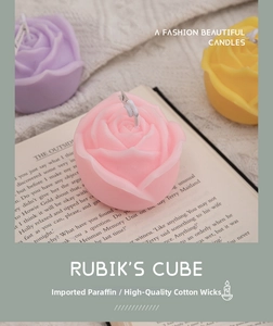 Macro detail of rose-shaped scented candles in pastel pink, purple and yellow colors