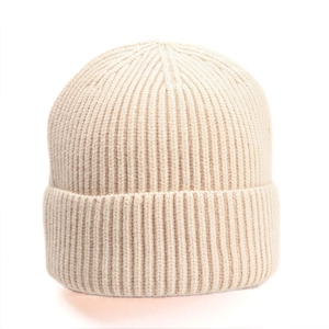Detail of oatmeal ribbed knit beanie showing thick warm texture and folded cuff