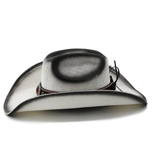 Detail of woven western cowboy hat with gradient spray paint and gemstone band
