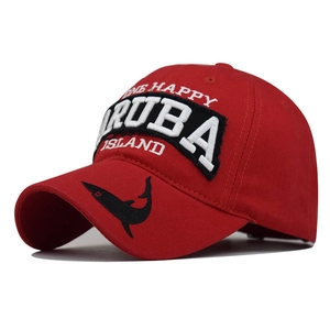 Detail of red cotton baseball cap with Aruba embroidery and shark silhouette on the brim