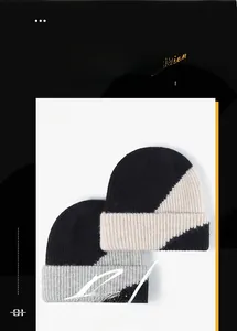 Detail of color-block knit beanies showing ribbed texture and dual-layer warmth