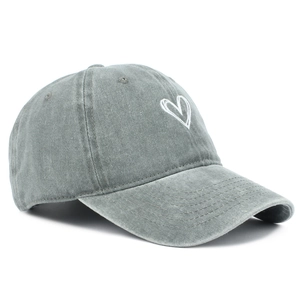 Detail of grey washed cotton baseball cap featuring white heart embroidery and retro texture
