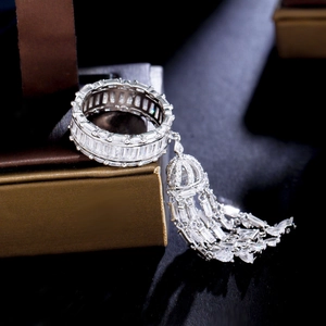 Silver ring with dazzling tassels and micro-set zircons on a jewelry box