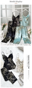Detail of floral printed satin pajama set with V-neck camisole and matching trousers