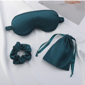 Three-piece dark cyan silk sleep set including eye mask, scrunchie, and storage bag