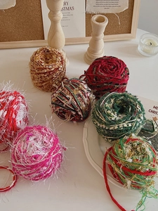 Detail of colorful chenille Christmas yarn balls for DIY crafts and holiday decor