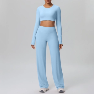 Detail of light blue long-sleeve crop top and high-waist wide-leg yoga pants set