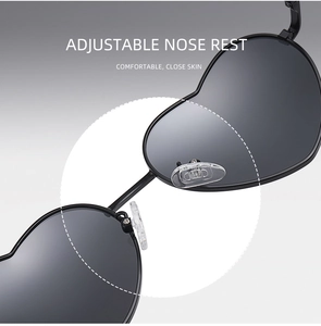 Detail view of adjustable silicone nose pads on heart-shaped metal sunglasses for comfort