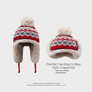 Bonnet aviateur en tricot jacquard avec motifs flocons et doublure en polaire chaude