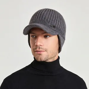 Men's winter knit beanie with visor and ear protection in dark grey ribbed fabric