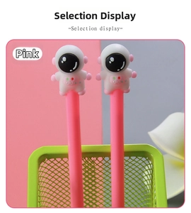Two pink astronaut gel pens with 3D figurines displayed in a green mesh pen holder