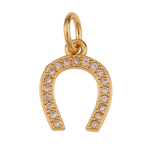 Detailed view of horseshoe charm in gold plated copper with micro-set zircon stones