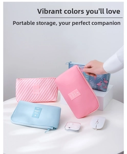 Detail showing various travel cable organizers in pink, blue, and flamingo print