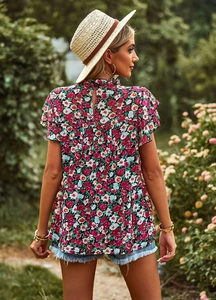 Detail view of the elegant floral print top with back button closure and ruffled butterfly sleeves