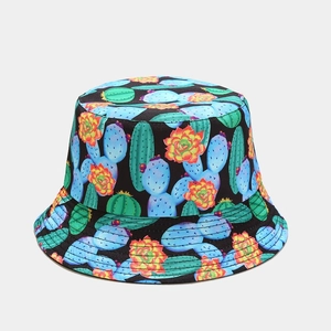 Detailed view of reversible sun hat with vibrant cactus and succulent print on black fabric