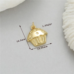 Macro shot of 14K gold-plated cake pendant with size 16.3x13.55mm and clear gems