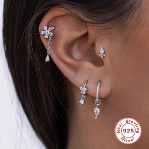 S925 sterling silver geometric earring set with floral ear cuff and zircon studs on model
