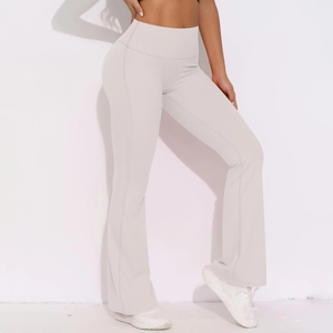 Detail view of high-waisted flared yoga pants in light grey with a slimming stretch fit