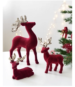 Burgundy flocked reindeer ornaments in three sizes with festive gold glitter antlers