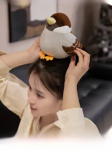 Cute plush sparrow bird toy with realistic brown wings and soft texture on model head