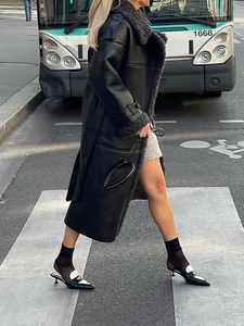 Street style long black leather coat with shearling collar and loose silhouette