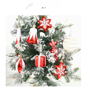 Detail of red and white Christmas ornaments set including candy canes and stars on a tree