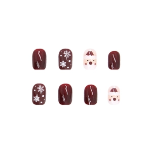 Faux ongles de Noël avec motifs flocons rouges et designs mignons du Père Noël nail art