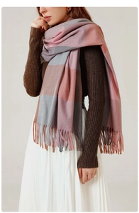 Close-up of elegant pink, grey, and brown plaid scarf featuring decorative soft fringes