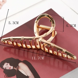 Detail view showing 11.7cm length dimensions of the bamboo texture gold metal hair claw