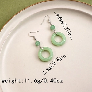 Detail view of jade-like beaded earrings with dimensions 6.4cm length and 2.5cm width