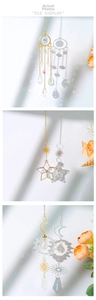 Detailed view of suncatcher set with gold celestial motifs and faceted crystals for windows