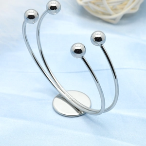 Polished silver double-layer C-shaped stainless steel bangle with four spherical ends