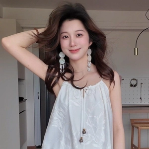 French style mother of pearl shell bead tassel earrings shown on a female model