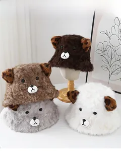 Detail of furry winter bucket hats with cute bear ears and leopard print accents