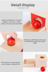 Detail of Montessori wooden coin box with smooth polished surface and red ball for kids