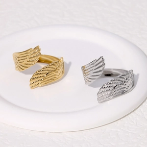 Polished stainless steel angel wing open rings in gold and silver finish with feather details