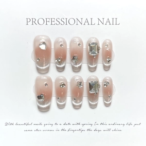 Handmade shimmer cat eye press-on nails with nude gradient and crystal diamonds