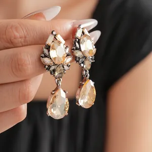 Vintage teardrop earrings with champagne crystals and grey rhinestones in alloy setting