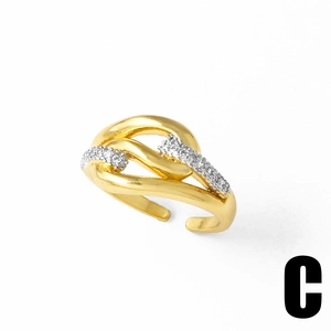 Detailed macro view of 18k gold butterfly twist ring featuring white crystal accents