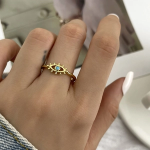 Evil eye open ring in 18k gold plating with turquoise and zircon on model's finger