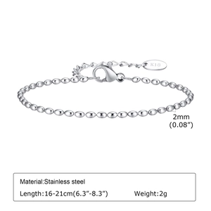Detailed macro view of 2mm silver stainless steel ball chain bracelet with K18 engraving