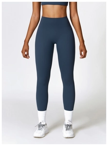 Front view of high-waist navy yoga pants and matching top on a fitness model