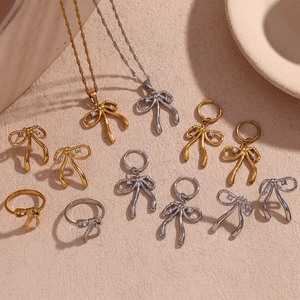 Bow jewelry set in 18K gold and silver with rhinestones, necklace and ring included