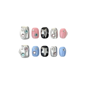 Handmade Y2K press-on nails set with pink and blue contrast and silver star designs