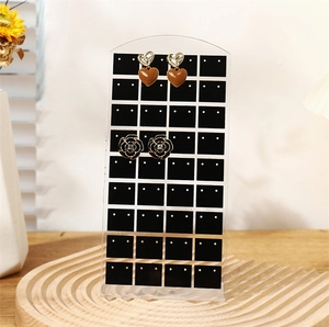 L-shaped acrylic jewelry stand with 72 holes for earring display on wooden base