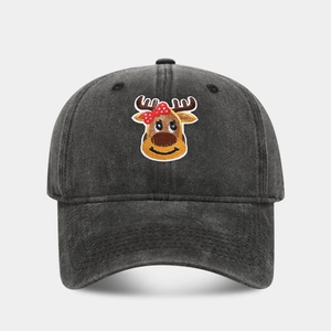 Close-up of the vintage washed black denim cap featuring a cute reindeer embroidery detail