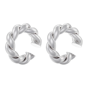 Macro shot of silver C-shaped twisted rope ear cuffs with high-gloss metallic finish