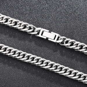 Detailed close-up of a silver Cuban link chain with a secure fold-over clasp on black texture