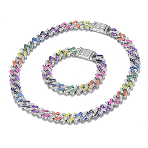 Detail of silver Cuban chain set with colorful enamel links and rhinestone buckle clasp