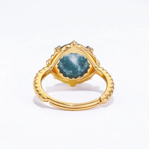 Vintage S925 silver ring in gold finish with green moss agate stone on white background